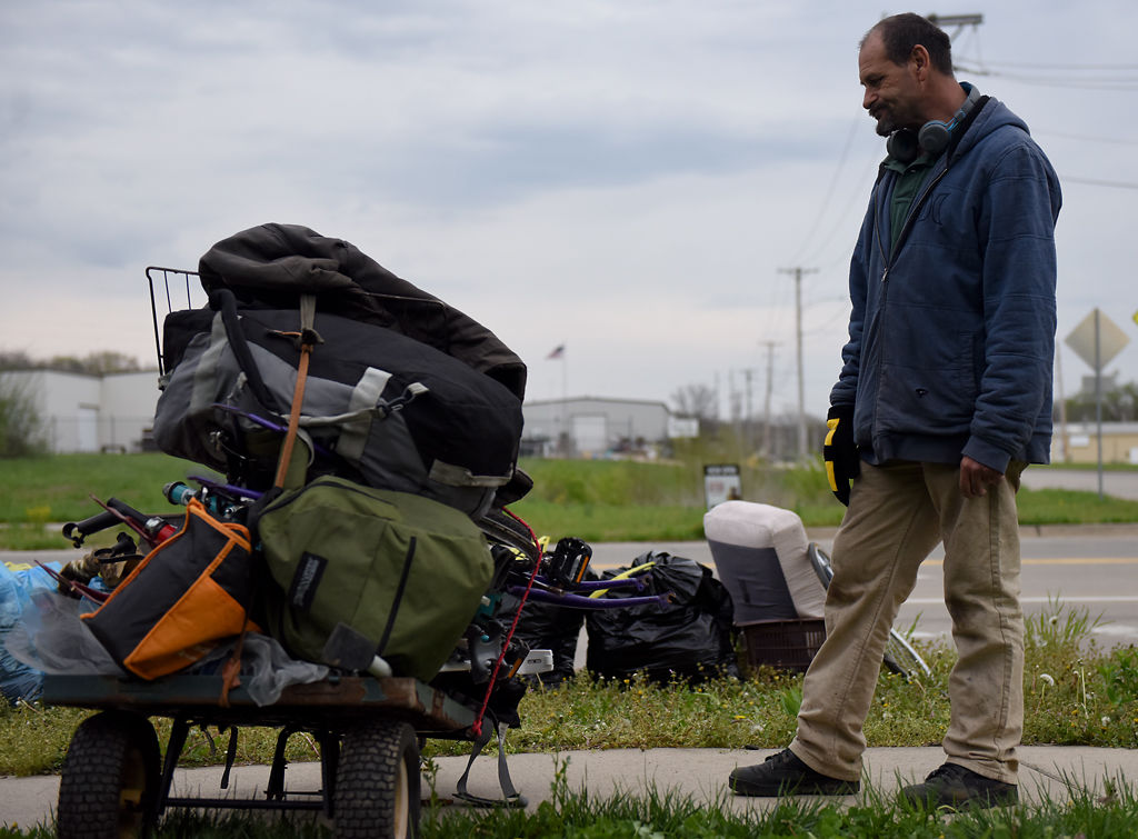 Bobby Hall looks at a wagon of items